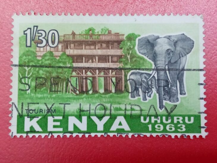 Issue:      Kenya Treetops Hotel and Elephants Uhuru Tourism 1963Stamp Type:     Stamp Number of Stamps:      1 Stamps Denomination:      1.30 Sh ( Shillings ) Issue Date:       1963 Issued By:      Kenya Post 